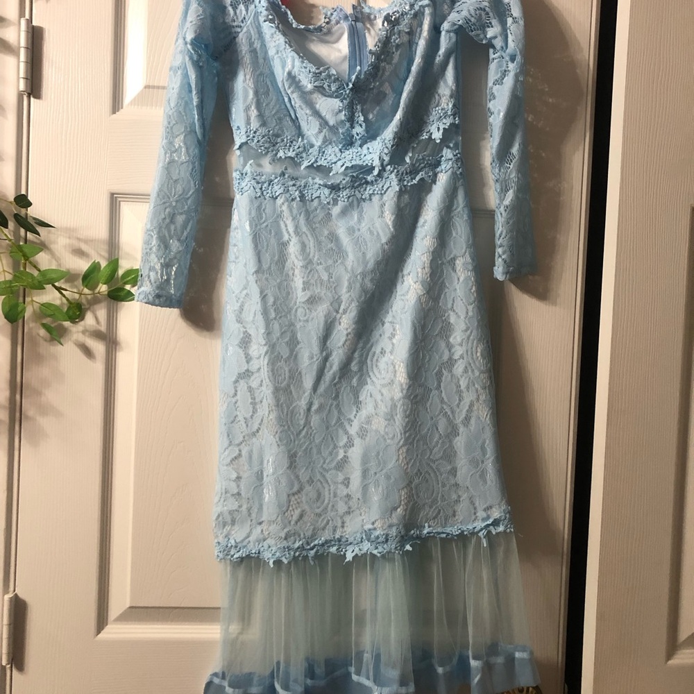 Light blue. Off the shoulder with mesh in the middle and bottom. Lace material
